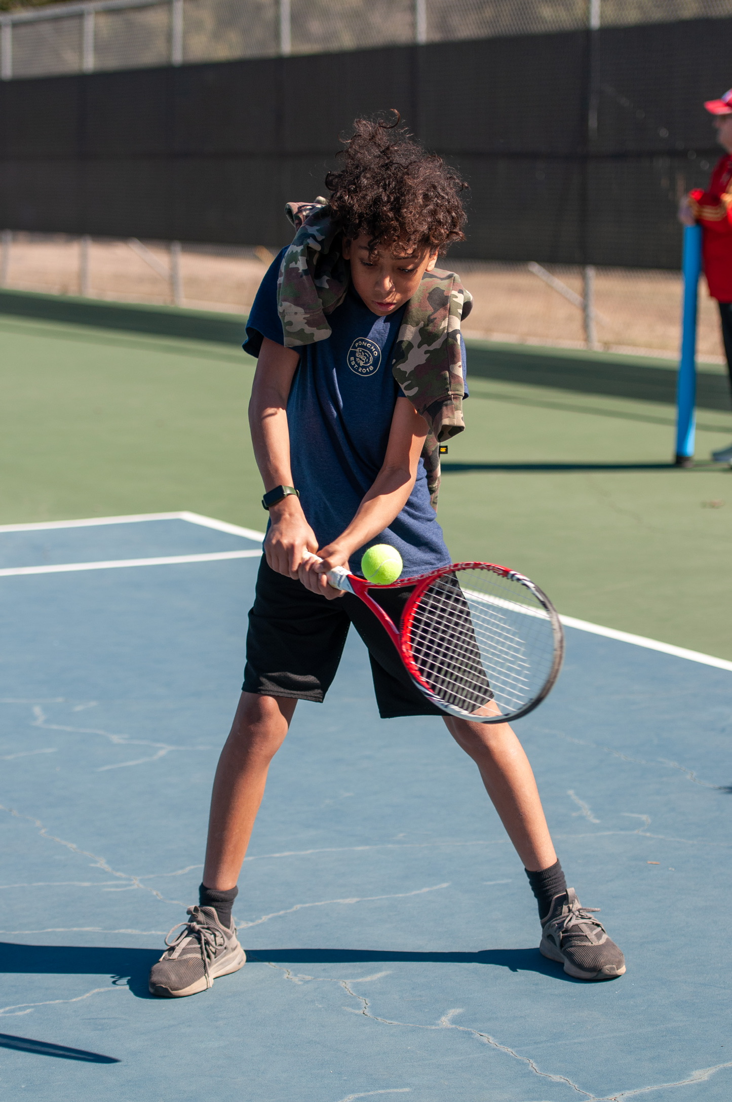 A young player hitting a forehand at a Tennis4All clinic