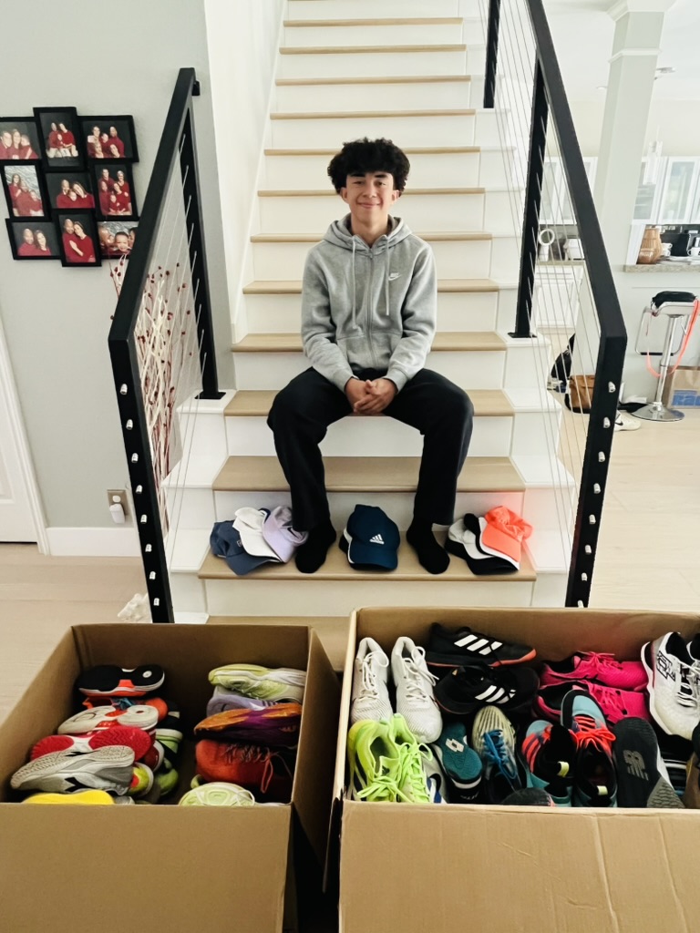 A box of donated tennis shoes ready for redistribution